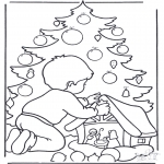 Coloriages Noël - Garçon chez l'arbre de Noël